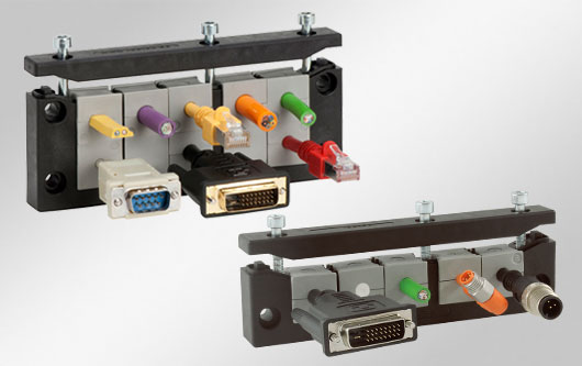 Teilbare Kabeleinführung mit zertifizierter Schutzart IP66, für Standardausbrüche schwerer Steckverbinder. Ein- oder zweireihige Bauweise.