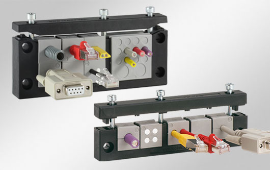KT-insatsbaserad kabelgenomföring med standardhåltagning för industrikontakter. Finns som enkel- eller dubbelradig.